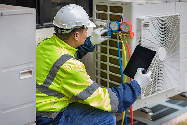 Professional Emergency Ac Repair technician working in Holbrook, MA